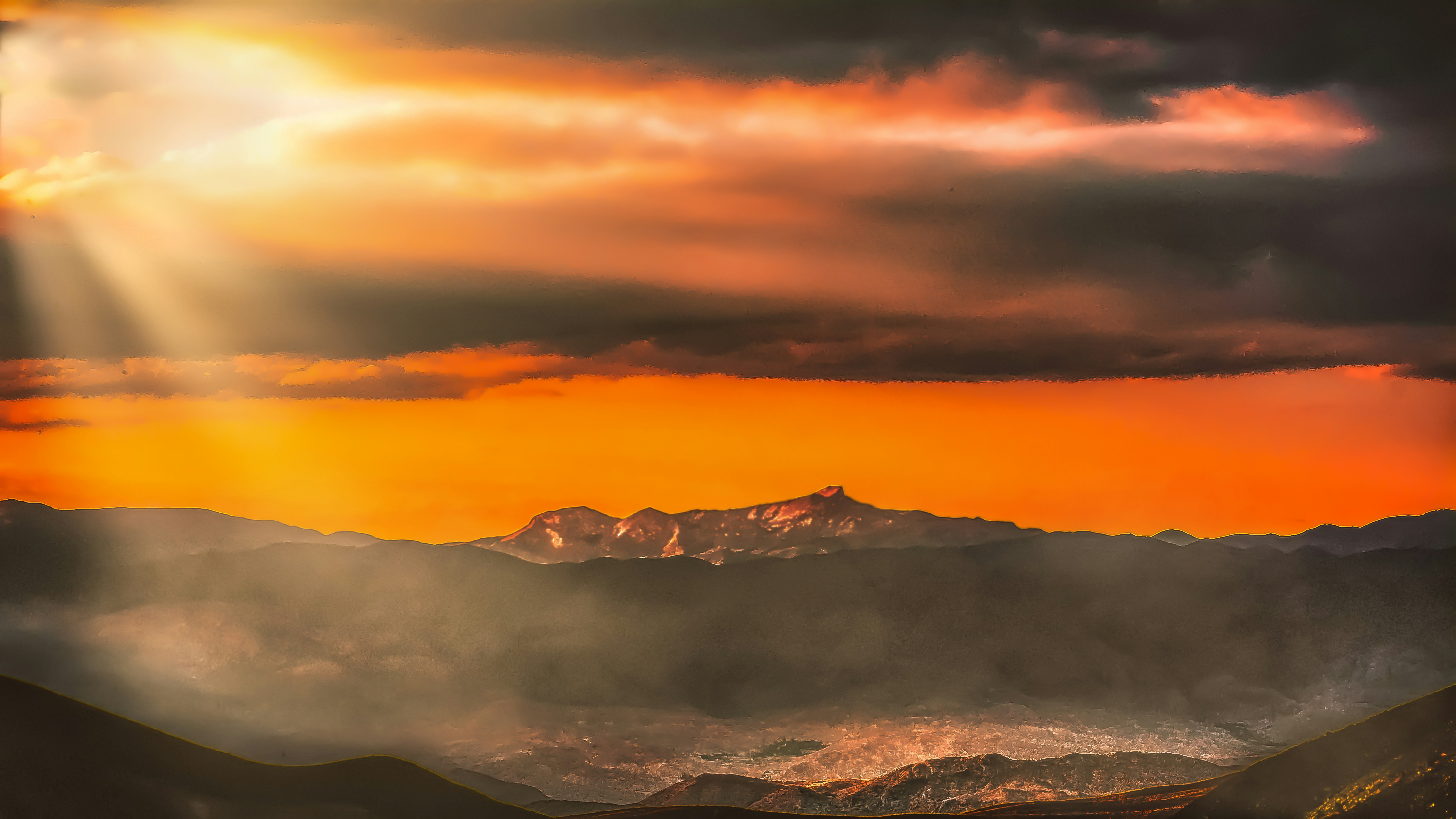 snow covered mountain during sunset